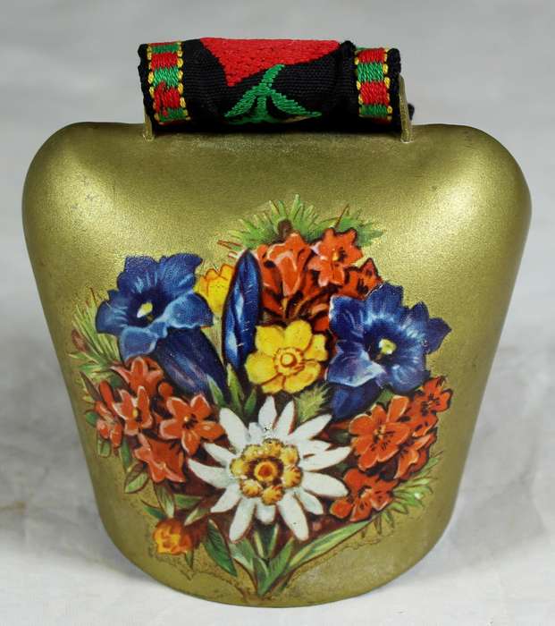 Cow bell with decorative strap
