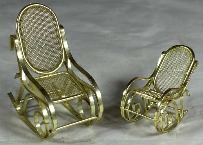 Pair of brass rocking chairs
