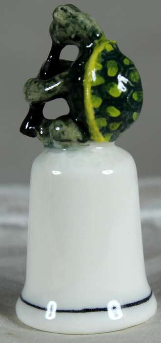 Bone China thimble - tortoise playing a flute - Klima porcelain