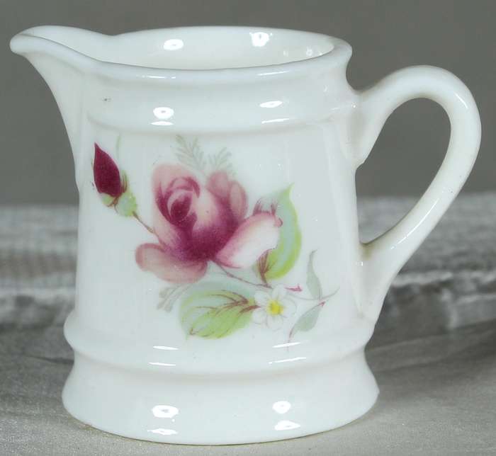 Miniature Tivoli pitcher with purple flowers