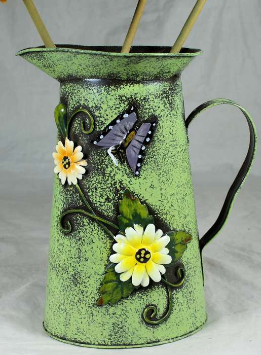 Metal pitcher with flowers