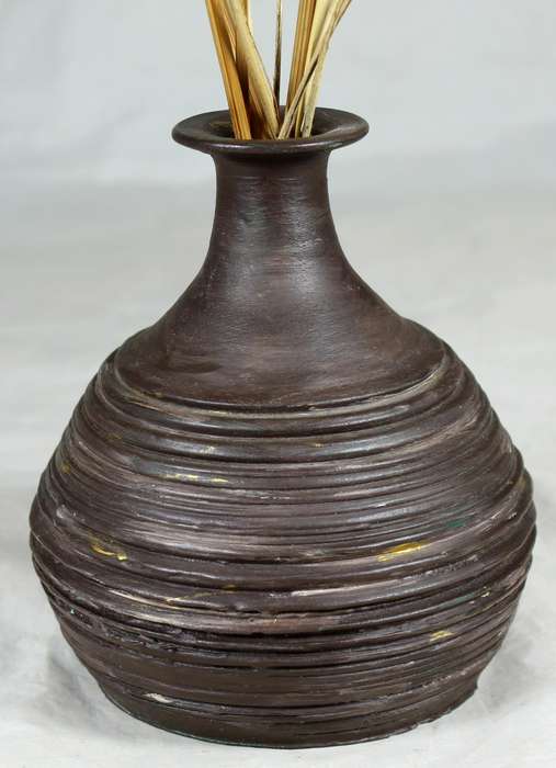 Pottery vase with dried arrangements