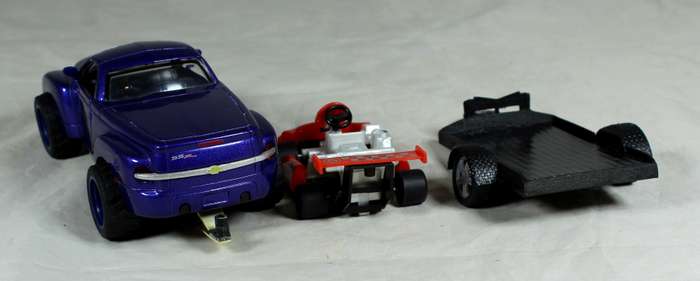 New Ray - Chevy SSR plus cart on trailer