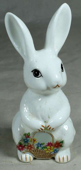 Porcelain bunny holding a paper basket