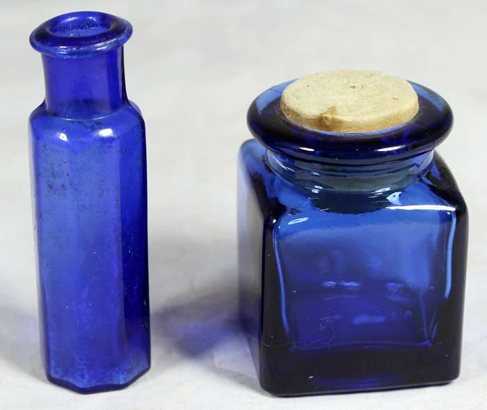 Pair of small blue glass bottles
