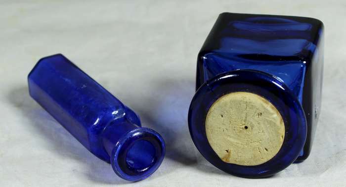 Pair of small blue glass bottles