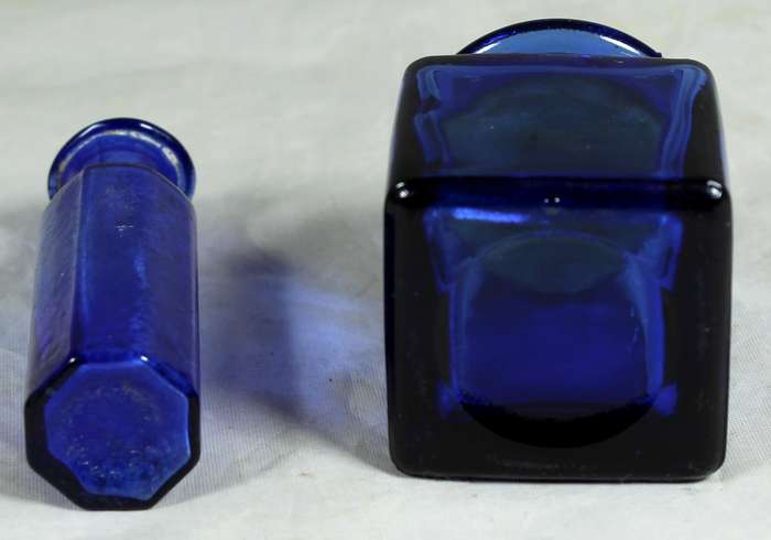Pair of small blue glass bottles