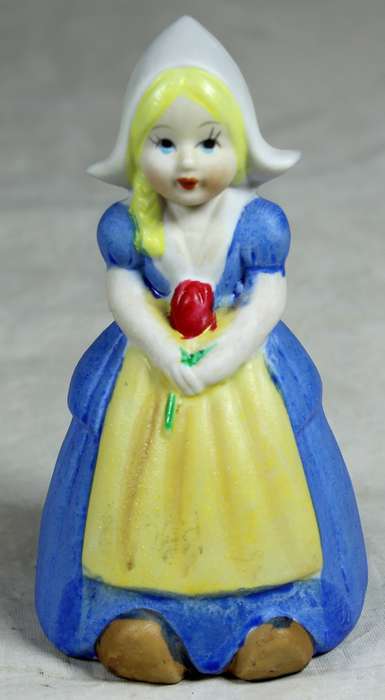 Ceramic bell Dutch girl in traditional clothes