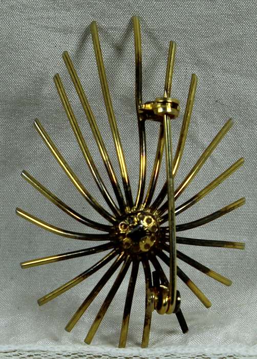 Pearl with starburst broach