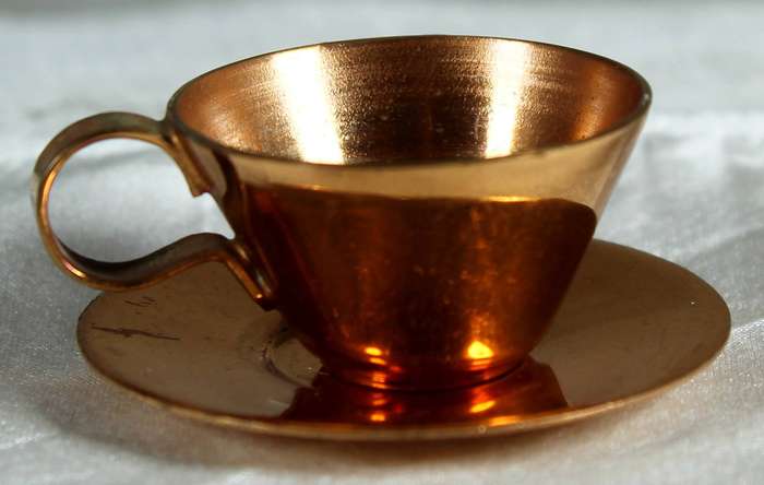 Miniature copper cup and saucer