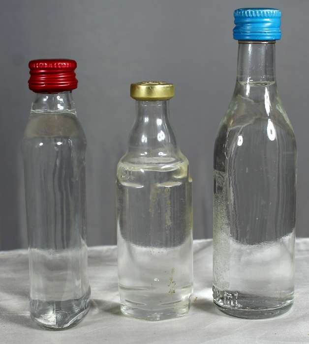 Empty liquor bottles - Trio of clear bottles