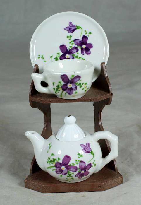 Miniature tea for one - purple flowers on a stand