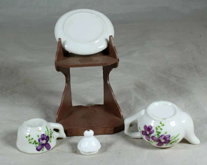 Miniature tea for one - purple flowers on a stand
