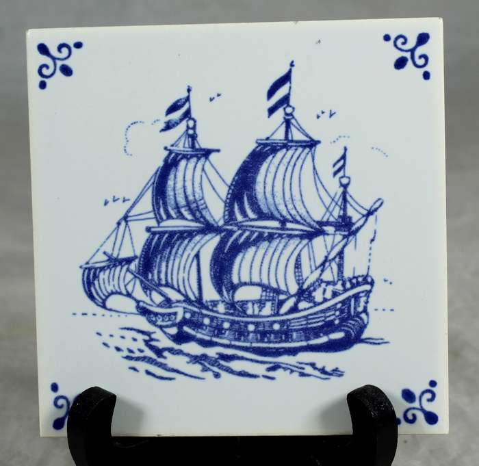 Mosaic ceramic tile with sailboat