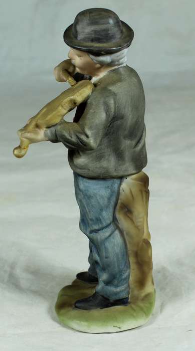 Ceramic figurine - man playing a violin