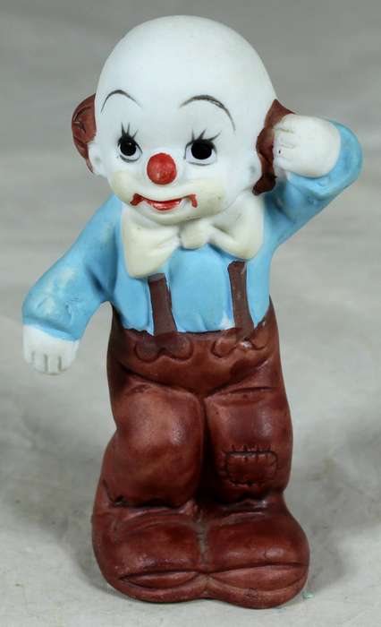 Ceramic clown wit suspenders