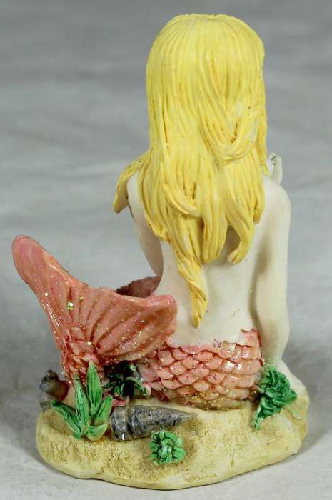 Resin mermaid in pink - seated holding a pearl