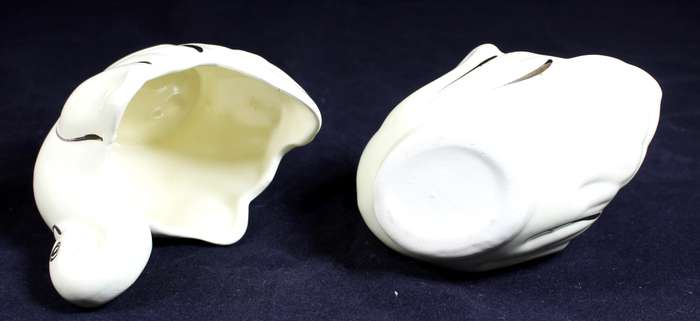 Pair of creme & gold swans