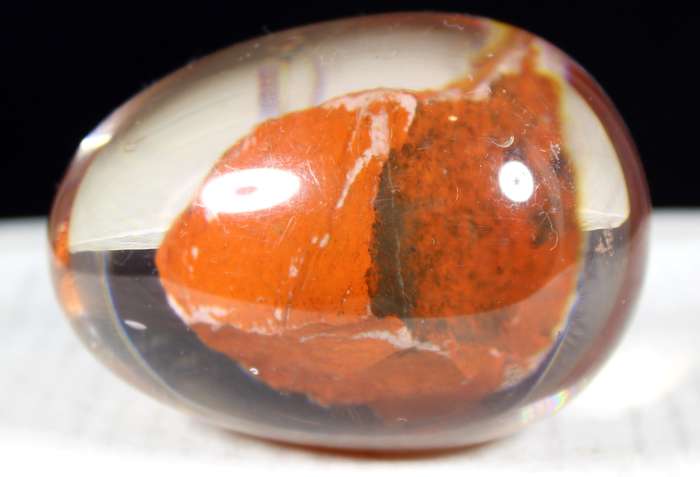 Glass egg paperweight with embedded semi precious stone