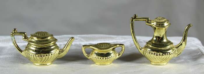 Trio of golden plated miniature pots