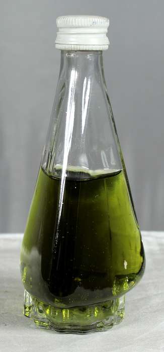 Mini liquor bottle - Triangular bottle with green liquid