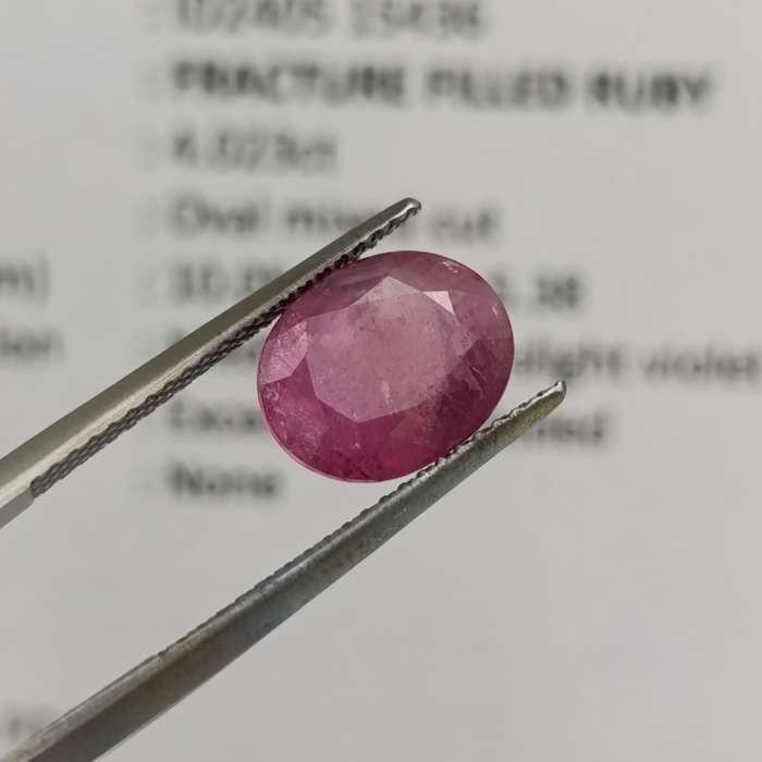 Fracture filled Ruby slight violet red Oval mixed cut 4.02 carat with Gemlab certificate
