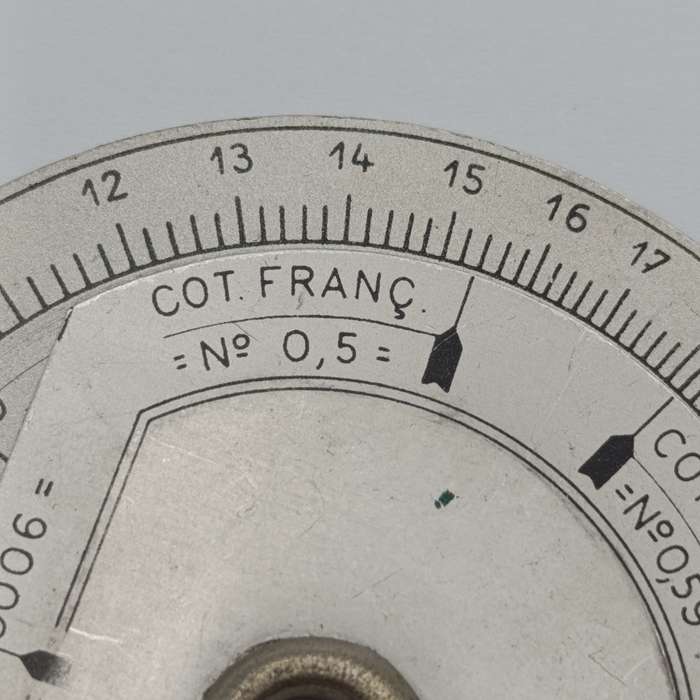 Vintage slide rule disk calculator
