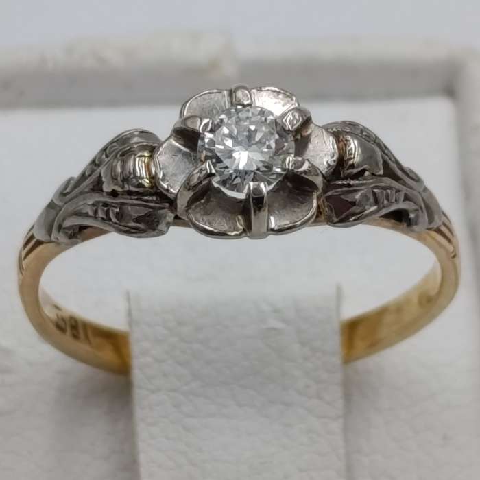 Antique 18kt white and yellow gold ring with a 20 plus pointer diamond