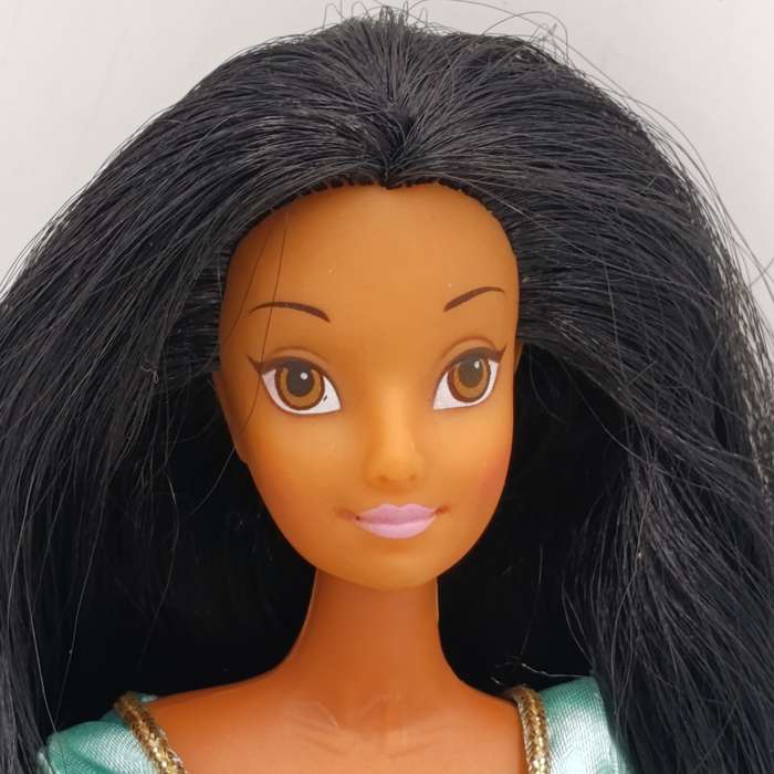 Doll with beautiful black hair and green dress