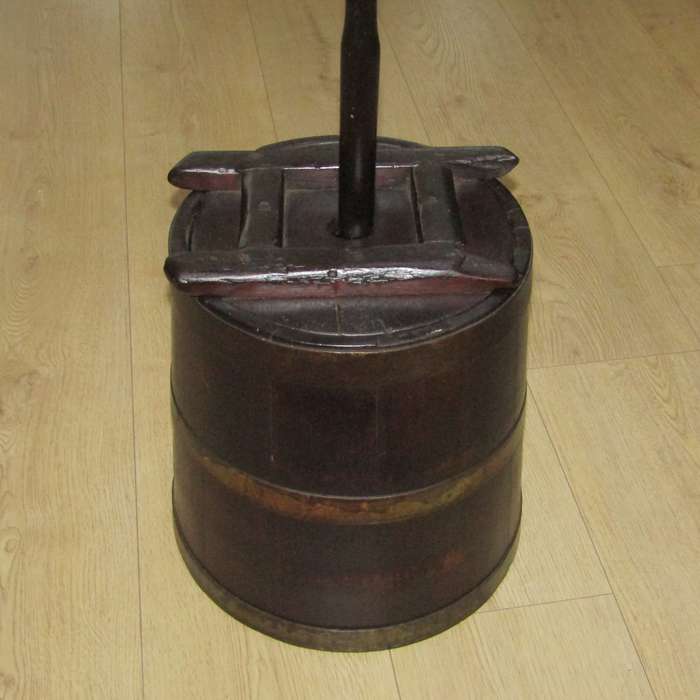 Antique wooden butter churn with stomper