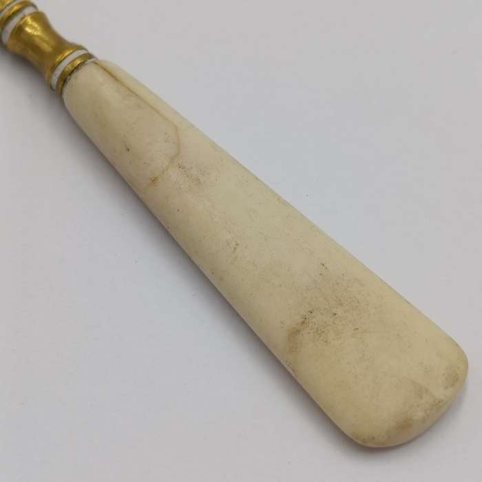 Antique brass bootlace puller with bone handle