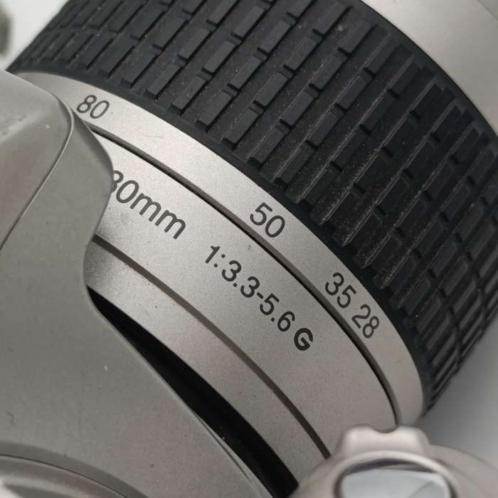 Nikon F22 camera with 28-80mm 1:3.3-56 lens in camera bag