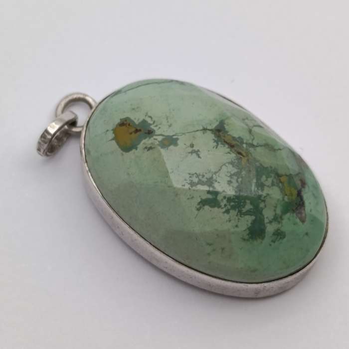 Variscite faceted cabochon 11g with silver surround - stone about 25 carat