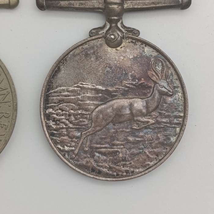 Pair of WW2 medals issued to 214152 C.J. maker