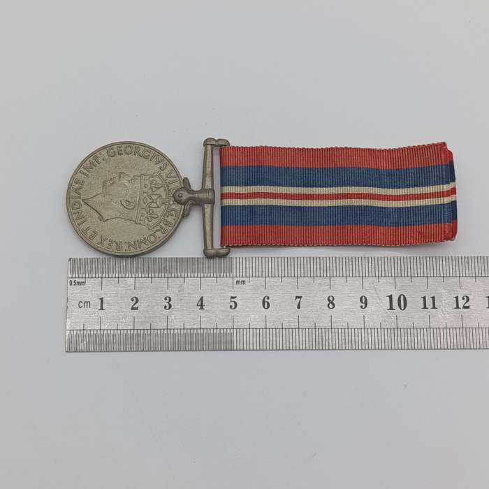 Pair of WW2 medals issued to 214152 C.J. maker