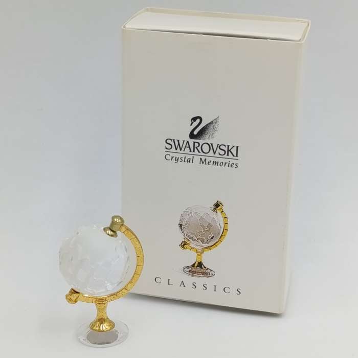 Swarovski crystal memories world globe ornament in box - small chip in South America