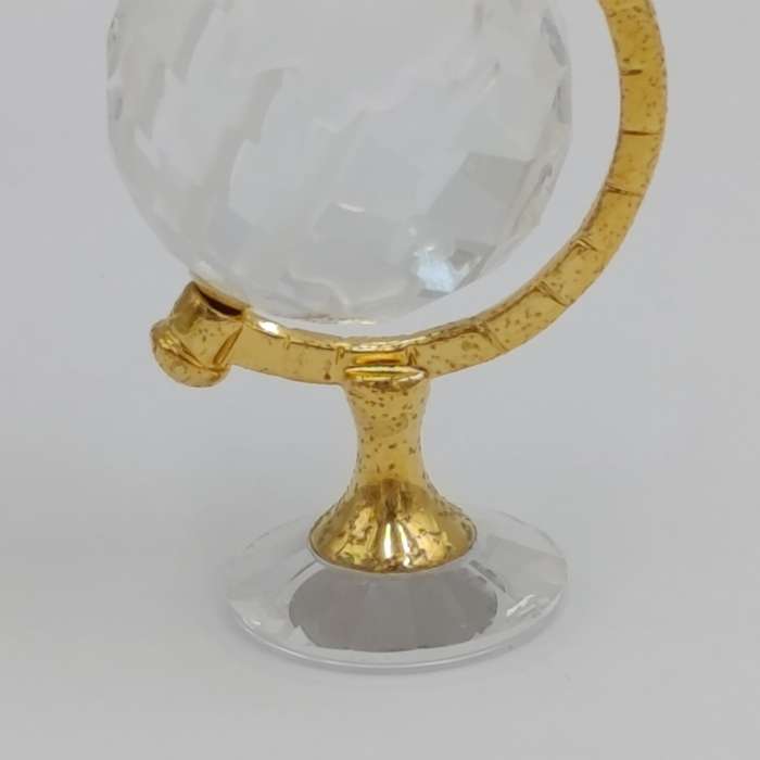 Swarovski crystal memories world globe ornament in box - small chip in South America