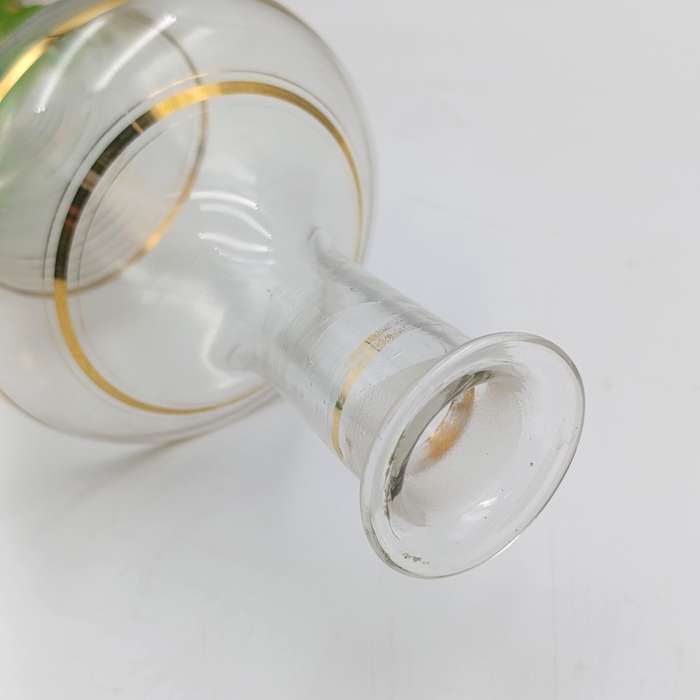Beautiful vintage glass decanter with green glass top