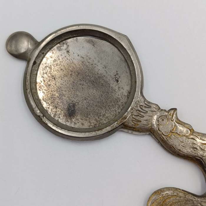 Vintage candle snuffer with rooster