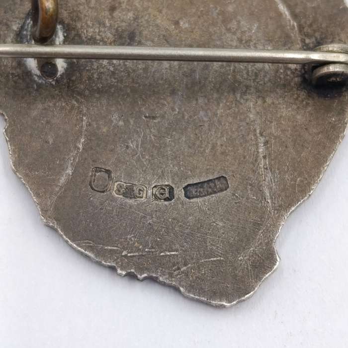 Pair of sterling silver Volkspele brooches plus R10 donation brooch