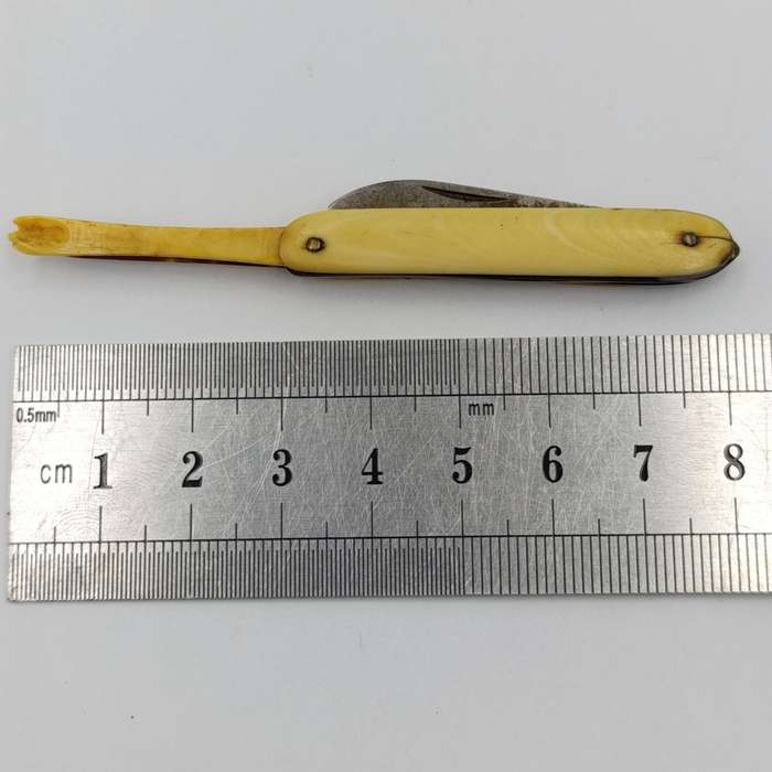 Antique small pocket knife with snuff spoon and picks