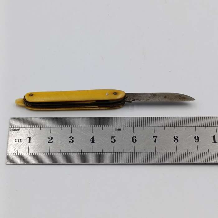 Antique small pocket knife with snuff spoon and picks