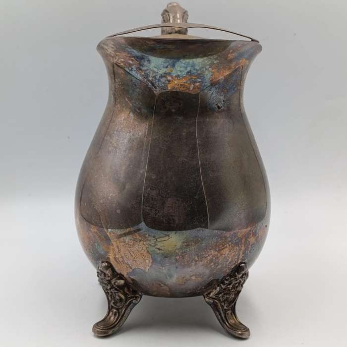 Antique silverplated pitcher with ice stopper