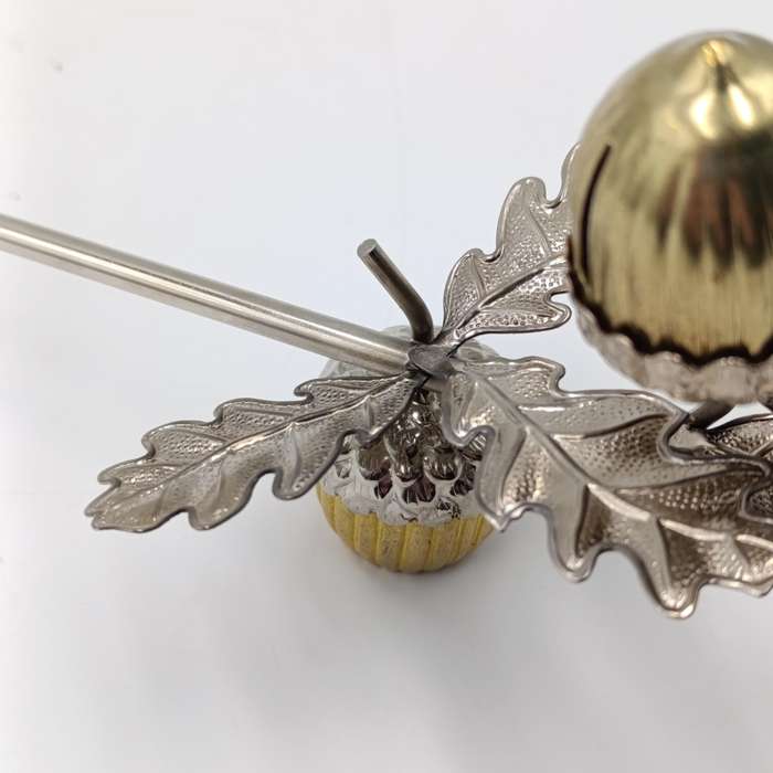 Acorn shaped candle snuffer