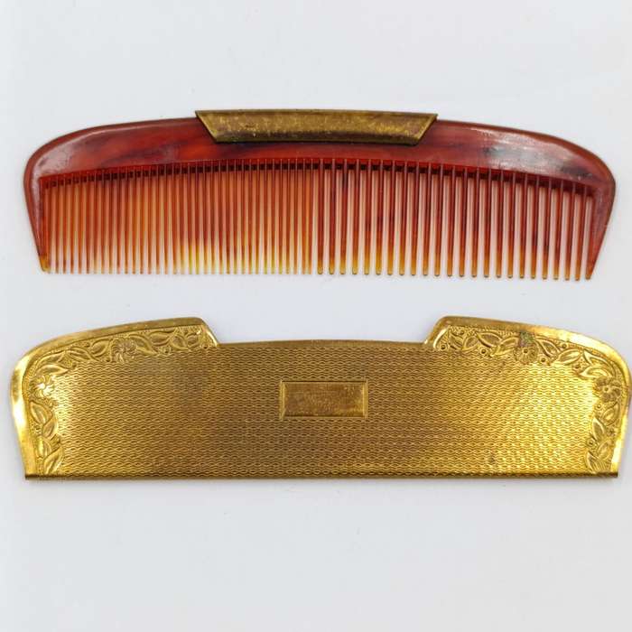 Antique pocket comb with brass case