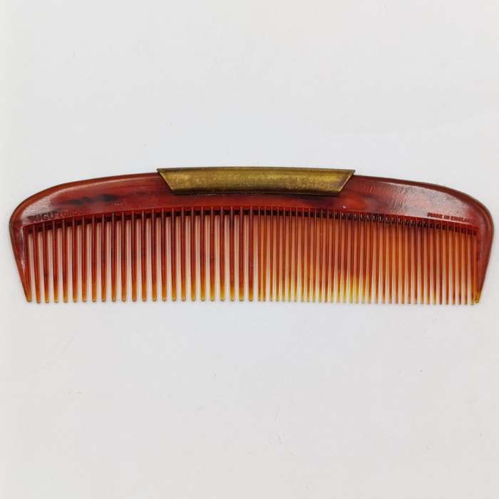 Antique pocket comb with brass case