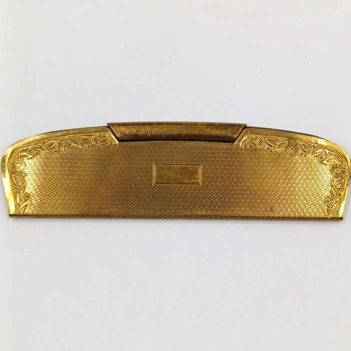 Antique pocket comb with brass case