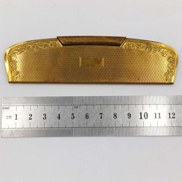 Antique pocket comb with brass case
