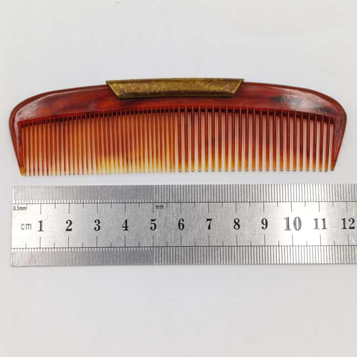 Antique pocket comb with brass case