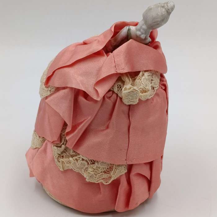 Antique porcelain doll needle cushion
